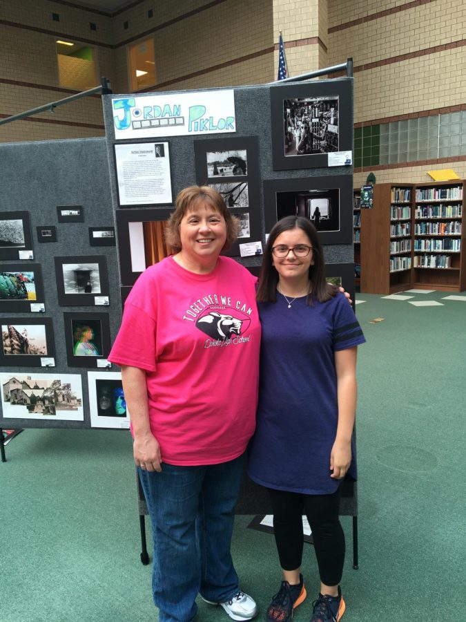 Me adn Mrs. Mielcarek next to the senior projects in the Media Center.