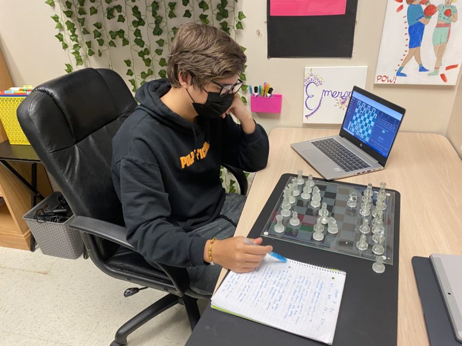 Senior Dom Monacelli researches and studies his chess moves in Independent Study.