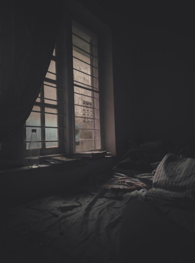 A room with dark tones emulating the darkness in the main characters life. IN a sense it is the external feelings the character is encapsulated by.
