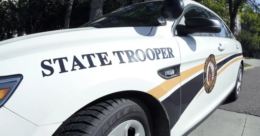 Police investigate a motorcycle crash scene on a highway east of Bismarck