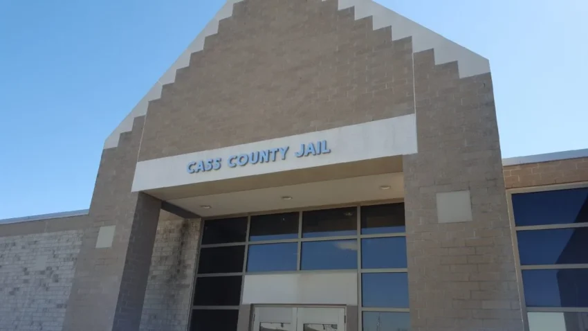 Exterior of a jail facility in Fargo with police and sheriff's office response