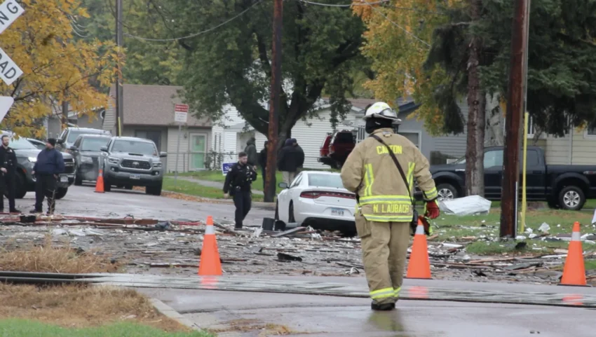 Burned debris and a damaged SUV outside a Canton home after an explosion