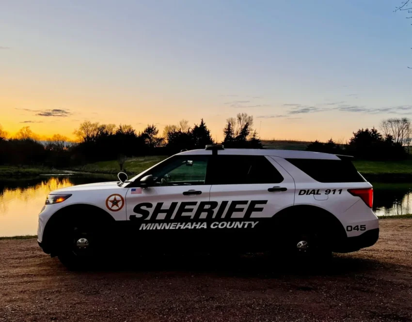 Police tape and emergency vehicles responding to a fatal assault scene in Hartford, South Dakota