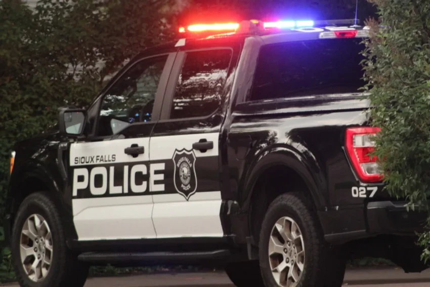 Police investigate a stabbing scene near downtown Sioux Falls at night