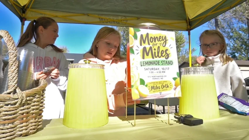 Children run a lemonade stand to raise money for West Fargo detective Miles Orth during his cancer battle